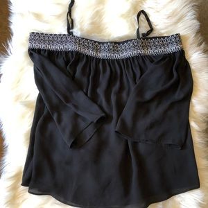 Black blouse. Elastic top w/ straps, flowy sleeves